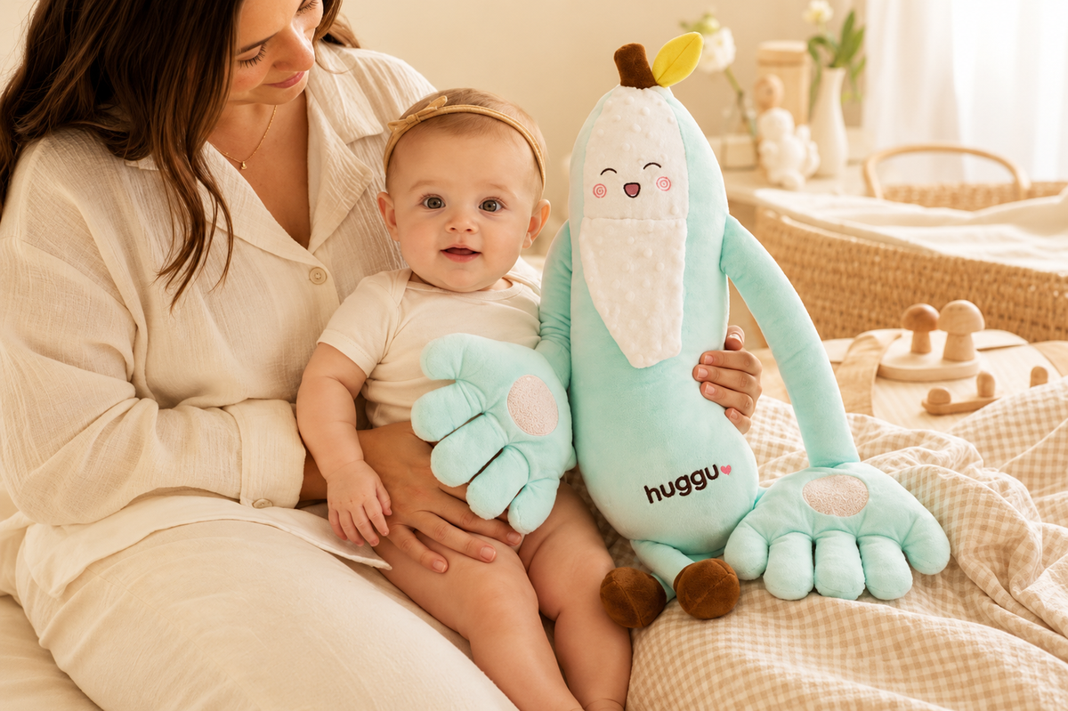 mum holding baby with Huggu — Australia